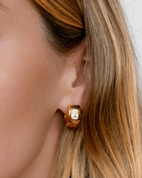 The Luv Aj Emerald Bezel Stone Huggies in Gold on Model View 2