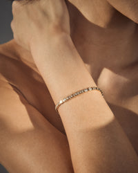 The Luv Aj Fine Emerald Bezel Tennis Bracelet on model View 4