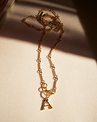 The Luv Aj Fine Initial Charm Belly chain flat lay photo View 3