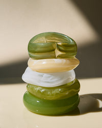 The Luv Aj Formentera Bangle set in green, stacked on flat surface View 3