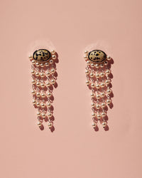 The Luv Aj Palma Pearl Studs on pink background View 3