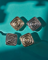The Luv Aj Seychelles Studs on turquoise background View 3