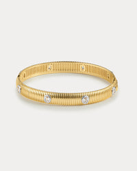 The Luv Aj Georgia Ridged Bangle in Gold on White Background View 1