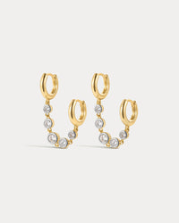 The Luv Aj Georgia Stone Huggies Set in Gold on White Background View 1