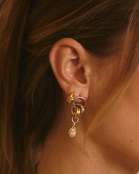The Luv Aj Georgia Stone Twisted Studs in Gold on Models Ear View 2