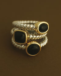 The Luv Aj Midnight Mesa Ring Set stacked on brown background View 2