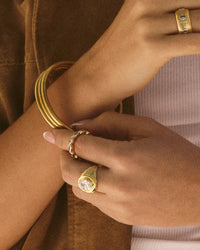 The Luv Aj Palais Eternity Ring in Gold on Model's Index finger View 3