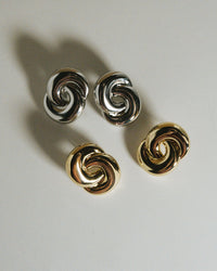 The Luv Aj Soltice Knot Studs in Silver and Gold in flat lay photo  View 4