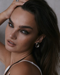 The Luv Aj Solstice Knot Studs in Silver on Model  View 4