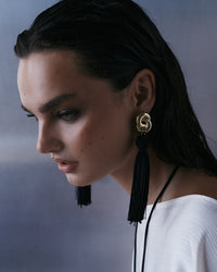 The Luv Aj Solstice Knot Tassel Earrings in Gold on Model  View 2