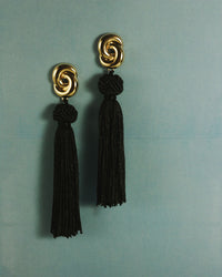 The Luv Aj Solstice Knot Tassel Earrings in Gold on sea-foam green background View 3