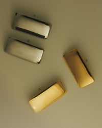 The Luv Aj Gold and Silver Solstice Metal studs, in a flat lay photo  View 5