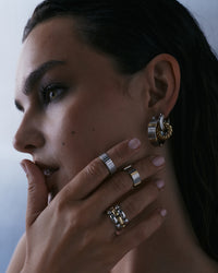 The Luv Aj Two-Tone Rope Interlock Hoops in Silver on model View 3