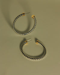 Flat Lay Photo of the Luv Aj XL Sierra Rope Hoops in Silver View 2