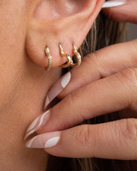 The That’s Amore Huggies are the middle earrings View 3