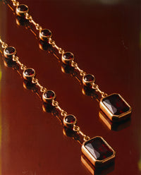 Luv Aj Elizabeth Garnet Stone Wrap Necklace in Gold, flat lay View 6