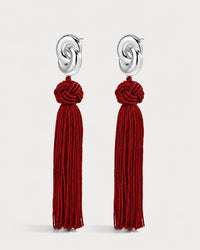 Luv Aj The Solstice Knot Tassel Earrings in Ruby, Silver on grey background View 2