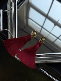 Luv Aj The Solstice Knot Tassel Earrings in Ruby, flat lay View 3