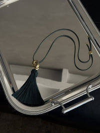 Luv Aj The Solstice Knot Tassel Necklace in Emerald, flat lay View 3