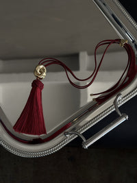 Luv Aj The Solstice Knot Tassel Necklace in Ruby, flat lay View 4